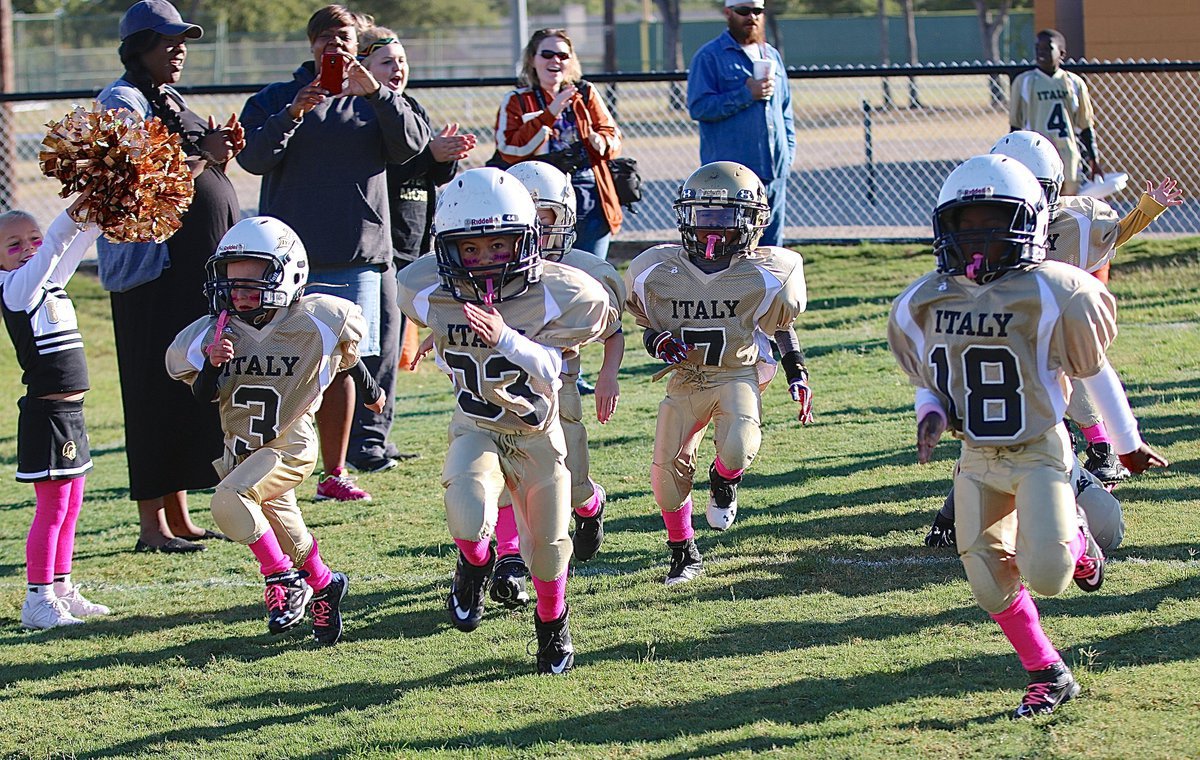 Image: IYAA C-team Gladiators Kace McDaniel(3), Ramzi Holt(33), “Lucky” Johnson(7) and Elijah Davis(18) storm Willis Field to take on the Mildred Eagles.