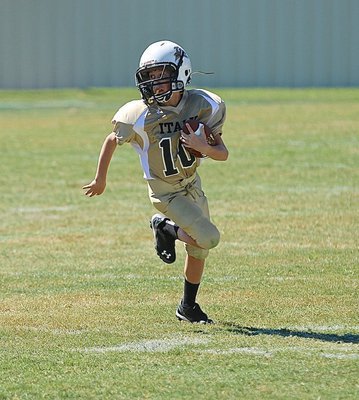 Image: A-team Gladiator Kort Holley(10) races downfield for a big gain.