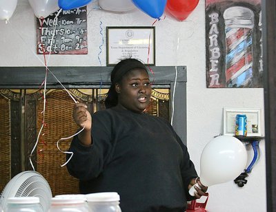 Image: Cynthia’s daughter Shercorya Chance was in charge of balloons during Customer Appreciation Day at Dynamic Kut’z in Italy. Now it’s a party!