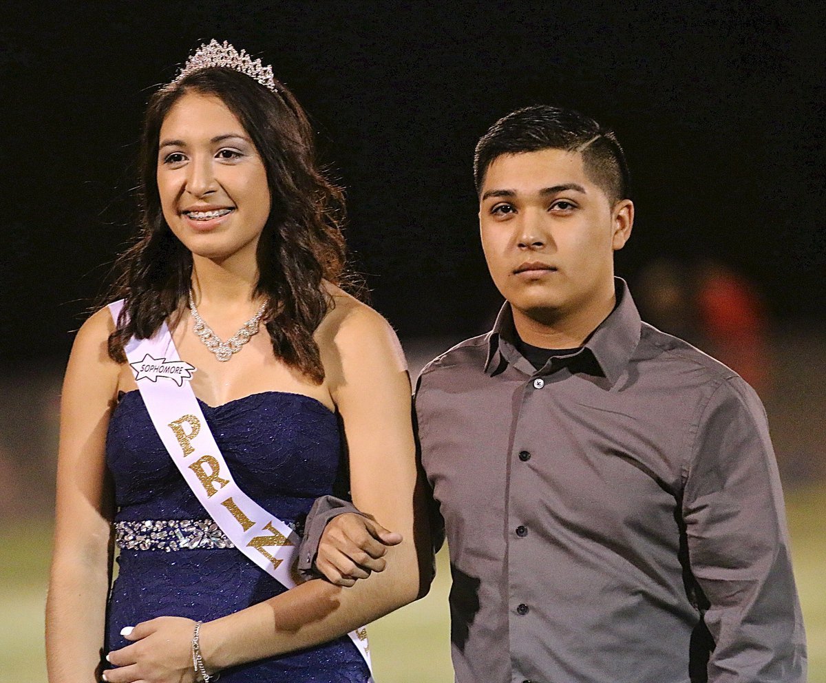 Image: Sophomore Homecoming Princess Elizabeth Garcia is escorted by Cruz Enriquez.