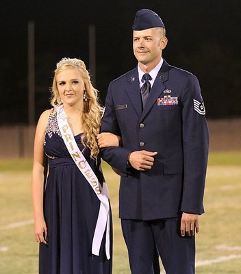 Image: Freshman Homecoming Princess Annie Perry is escorted by her brother and Air Force Sargent Brian Brewer who is in his 12th year of military service.