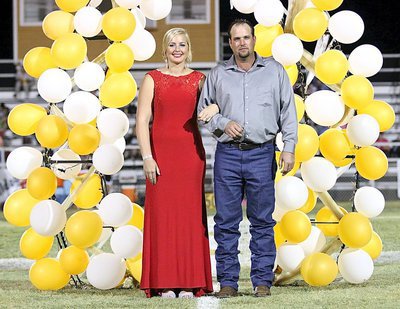 Image: Homecoming Queen Nominee Madison Washington, a senior, is escorted by her father, Matthew Washington.
