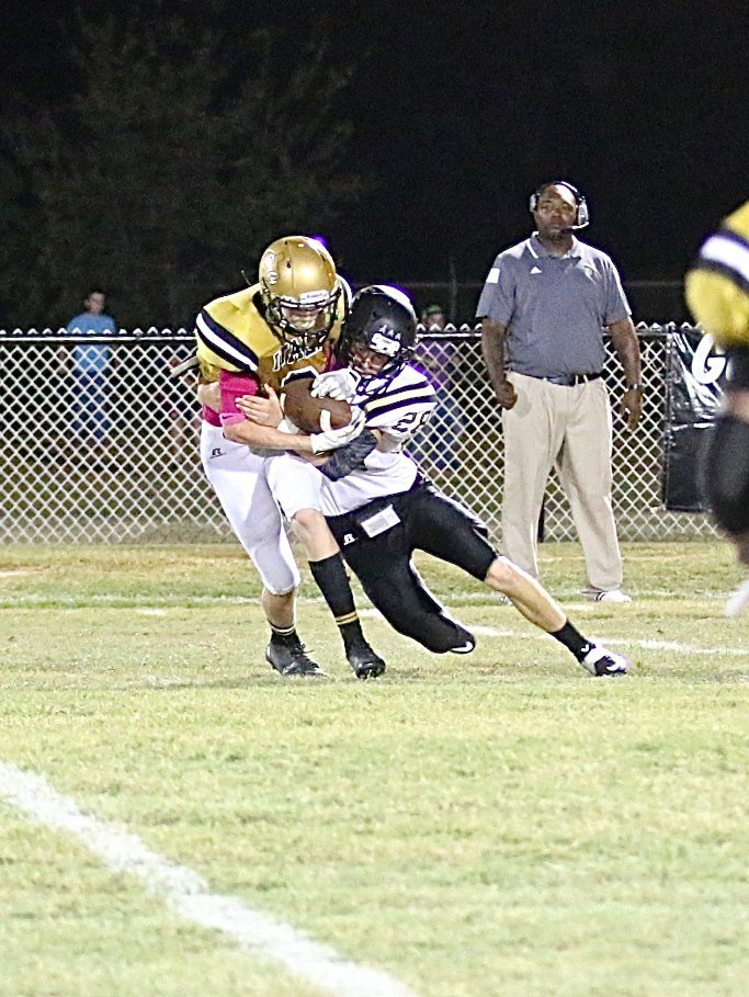 Image: Gladiator defender Clayton Miller(6) intercepts a Dawson pass attempt.