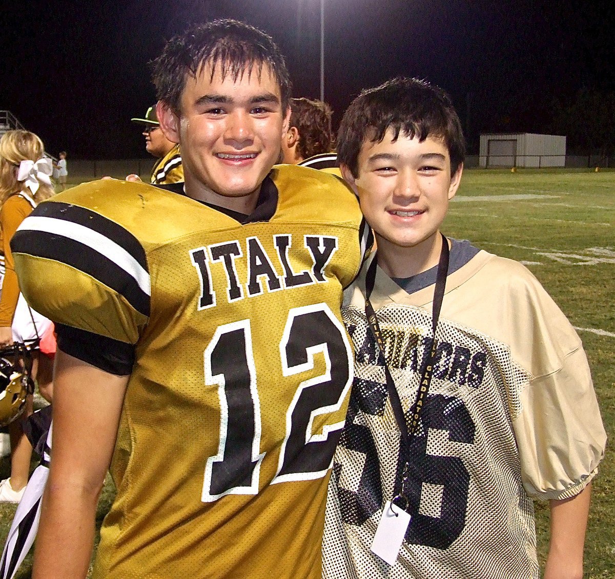 Image: Freshman Gladiator Kyle Tindol(12) celebrates Italy’s homecoming win with his little bro Cade Tindol(56).