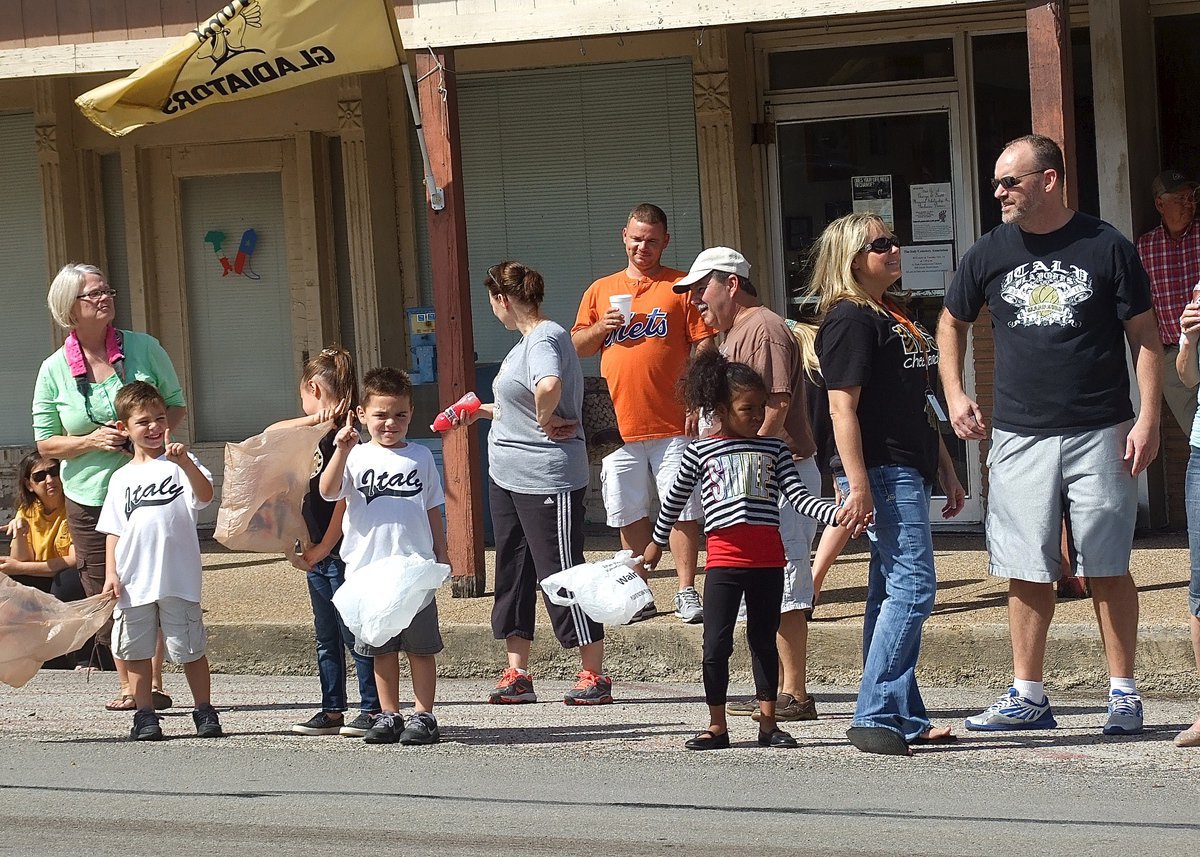 Image: With their candy bags in hand, everybody lines up in downtown Italy in anticipation of the parade.