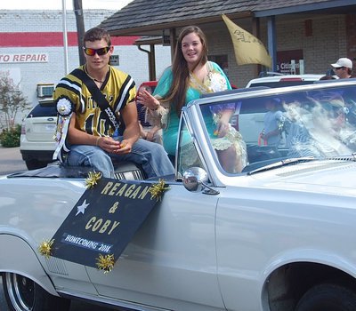 Image: Homecoming King Nominee Coby Jeffords(10) and Homecoming Queen Nominee Reagan Cockerham wave to the fans during the parade.