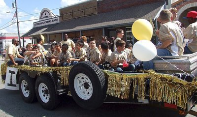 Image: The IYAA A-team Gladiators roll down the parade route with plenty of team spirit.