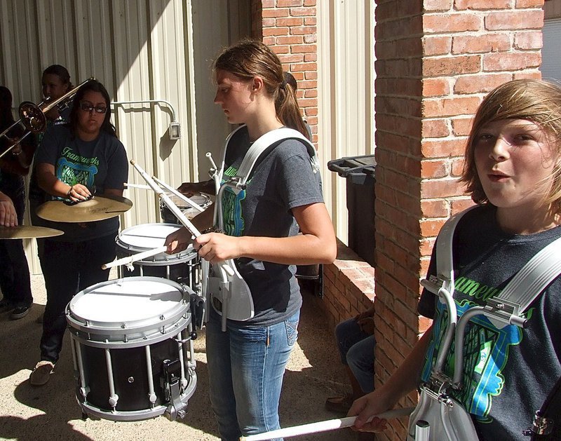 Image: Whitney Wolaver and Stockard Smithwick drum out the beat of champions.