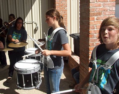 Image: Whitney Wolaver and Stockard Smithwick drum out the beat of champions.