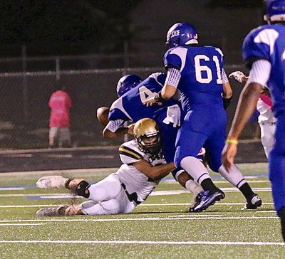 Image: Gladiator Hunter Merimon(3) pops the ball out and the ensuing fumble is recovered by teammate John Escamilla.