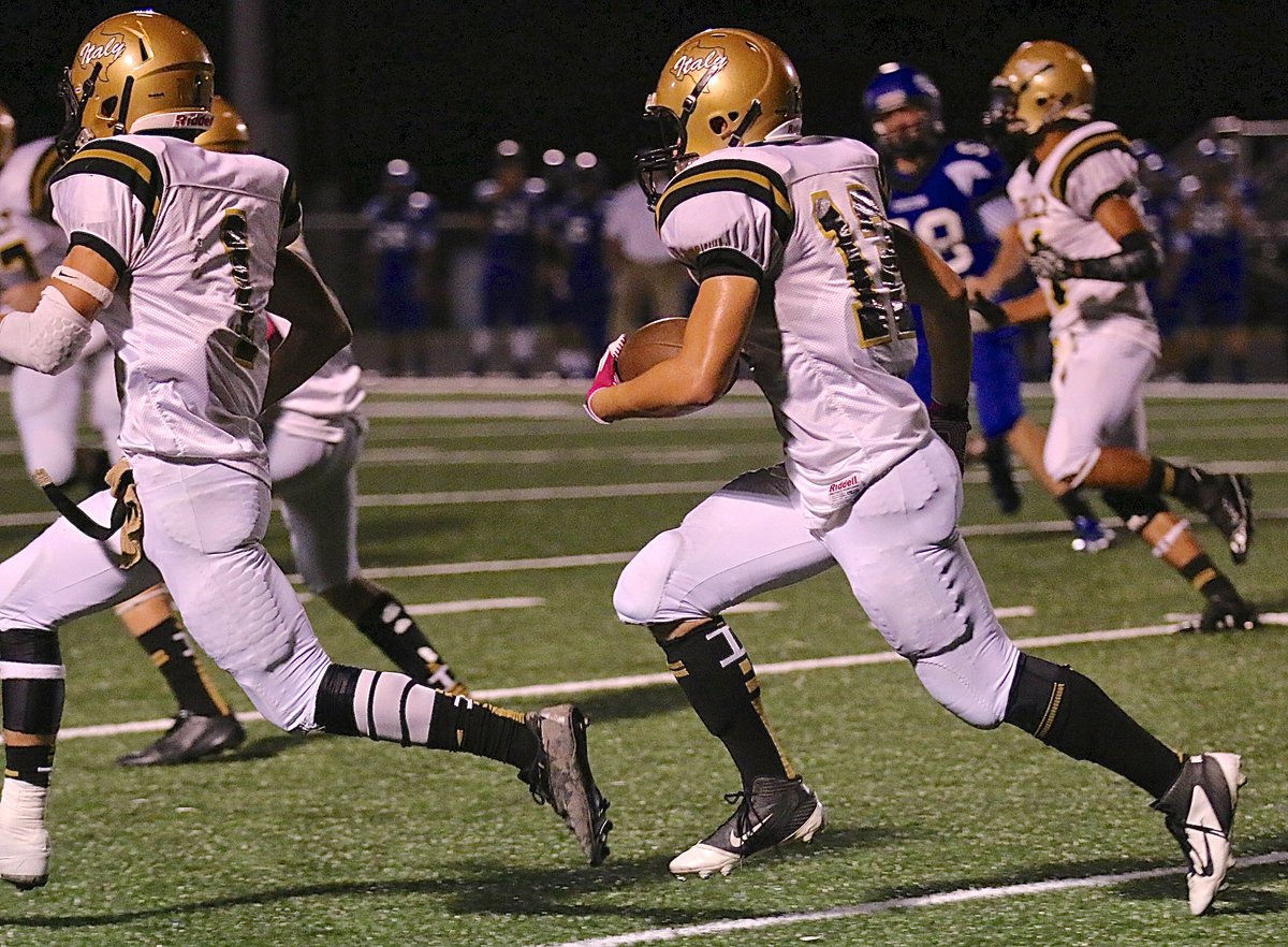 Image: Levi McBride(1) leads the way for Kyle Tindol(12) who sparks Italy with a long kickoff return.