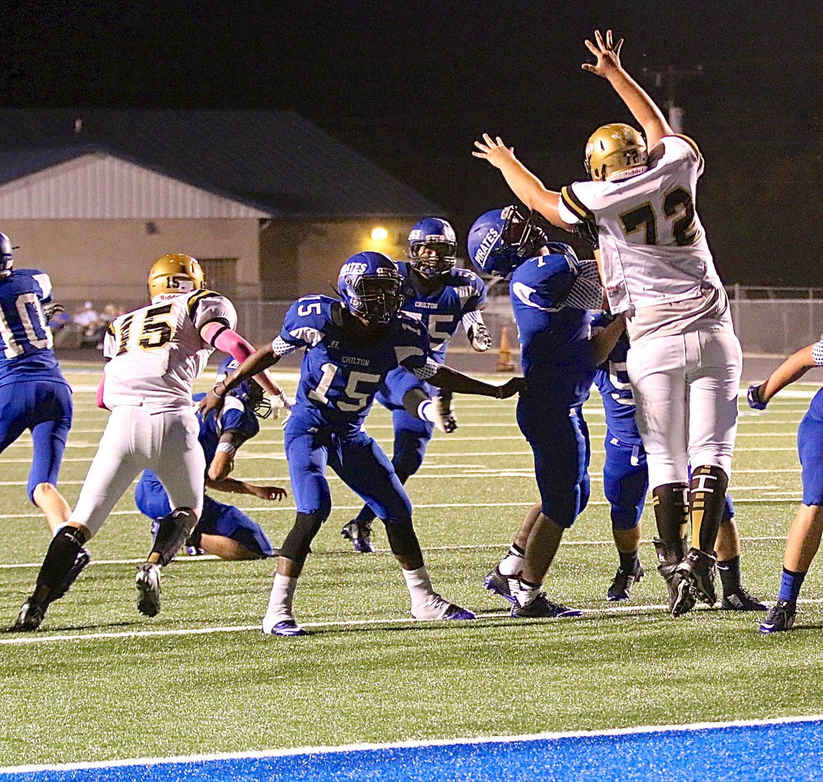 Image: Gladiators Cody Boyd(15) and Aaron Pittmon(72) go after a Pirate point-after kick attempt.