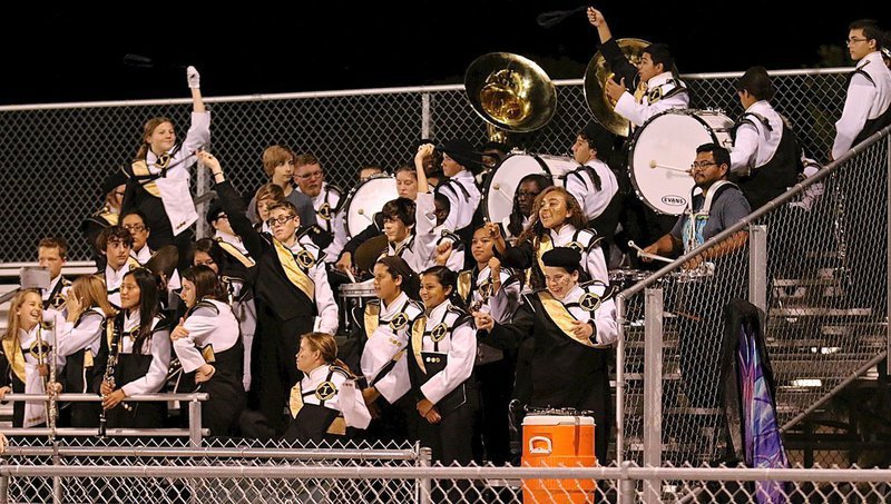 Image: The Gladiator Regiment Band cheers on their guys in gold.