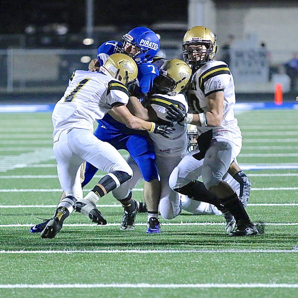 Image: Italy’s Levi McBride(1) collides with a Pirate ball carrier to help his buds bring down a pesky Pirate.