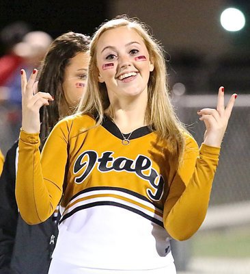 Image: Italy High School cheerleader Kelsey Nelson grins in hopes of a win.