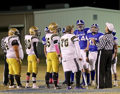 Image: Gladiator senior captains Ty Fernandez(64), Jack Hernandez(80), Cody Boyd(15) and Colin Newman(76) represent the gold and white during the pre-game coin toss.