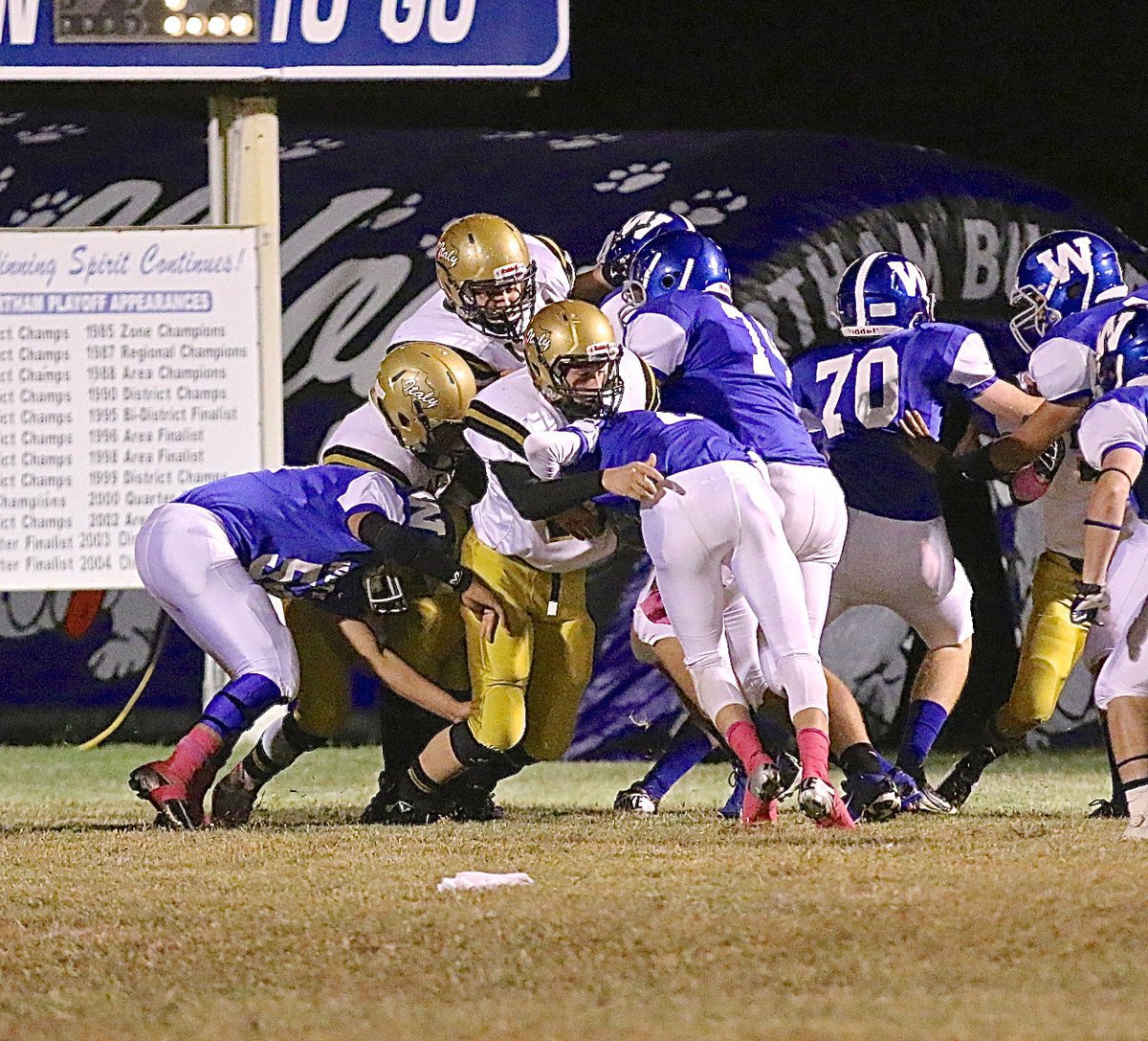 Image: Freshman defensive tackle Clay Riddle(77) keeps Wortham out of the endzone momentarily.