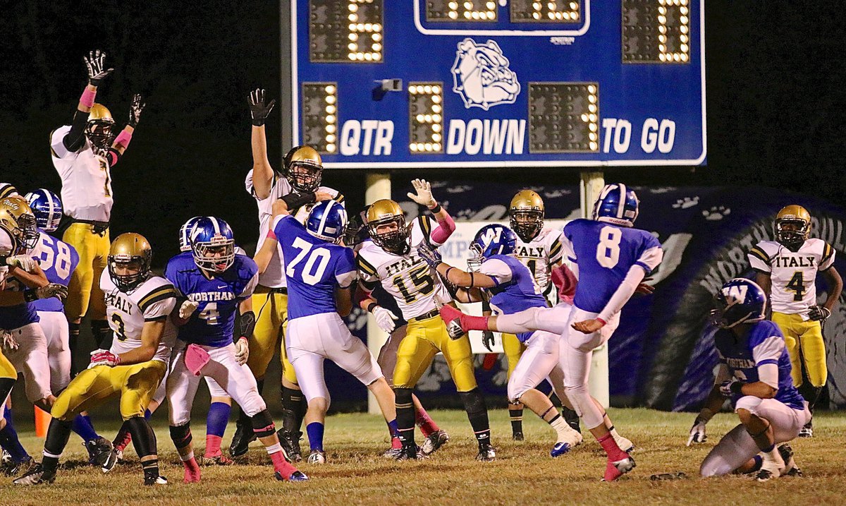 Image: Wortham takes an early 7-0 lead despite the efforts of Ryan Connor(7), Aaron Pittmon(72), Cody Boyd(15) and Hunter Merimon(3) trying to block the point-after kick by the Bulldogs.