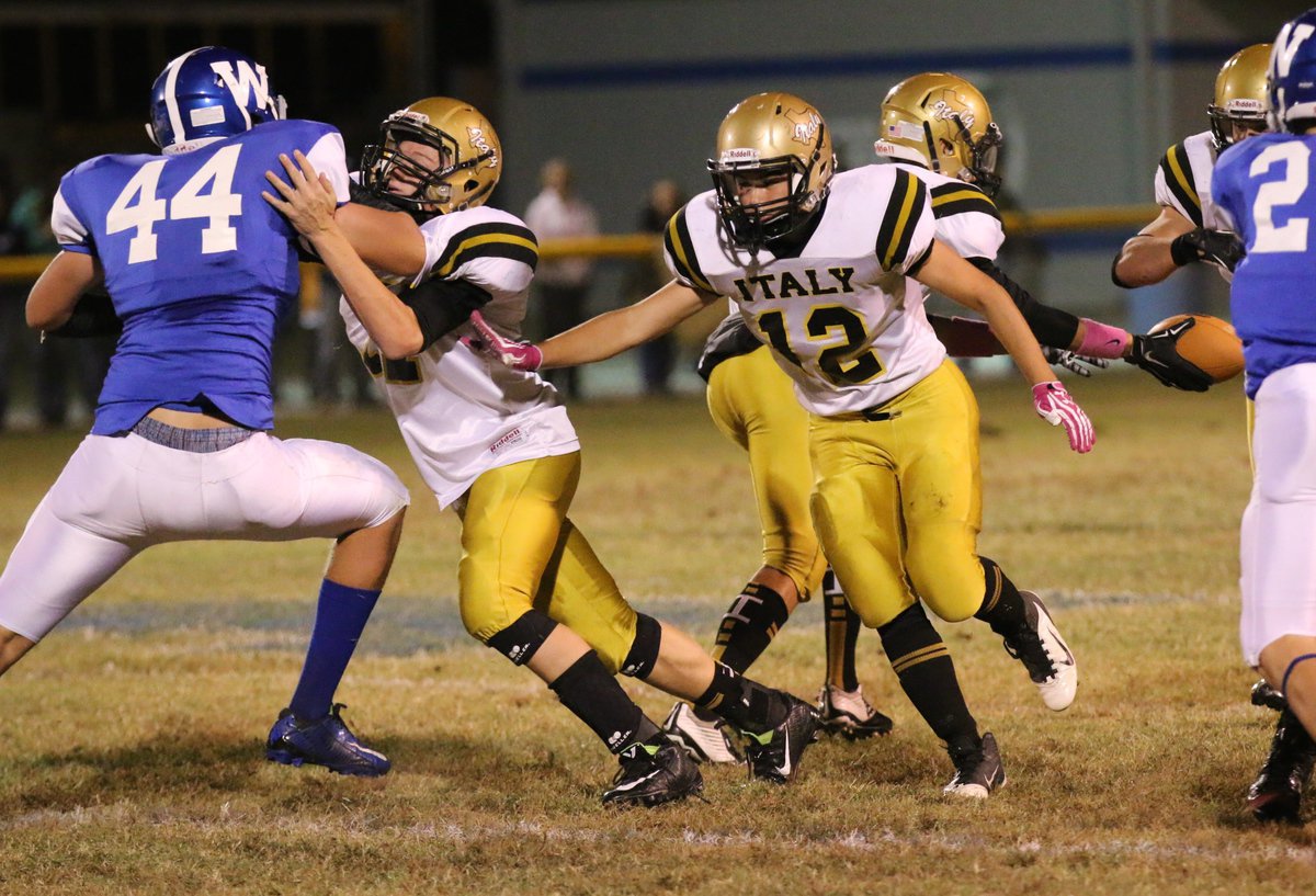 Image: Clay Riddle(77) and Kyle Tindol(12) open a running lane for the Gladiators.