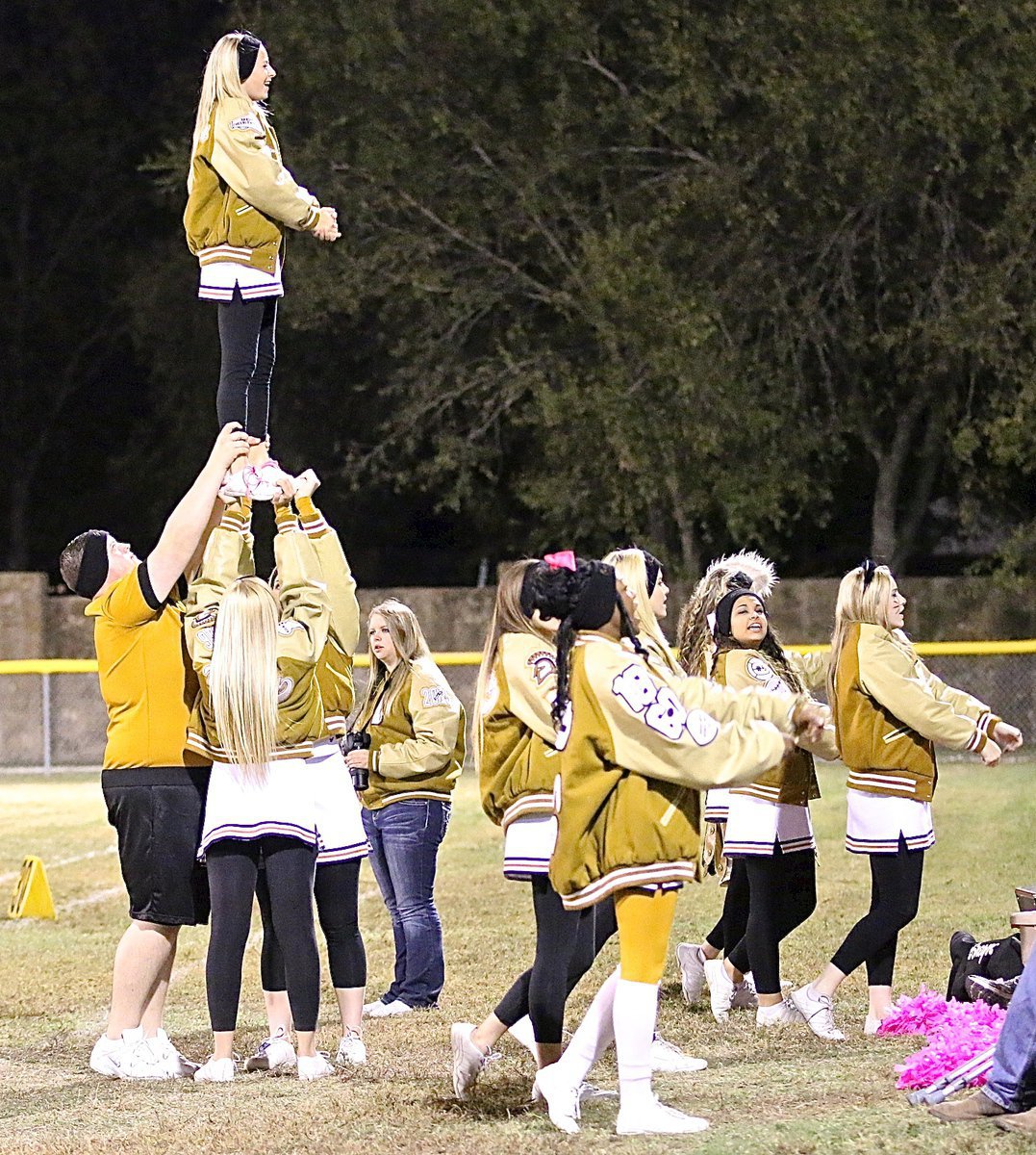 Image: Italy’s cheerleaders perform a stunt with Britney Chambers high above the action.