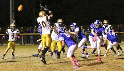 Image: Gladiator linebacker Coby Jeffords(10) tips a pass attempt by the Bulldogs.