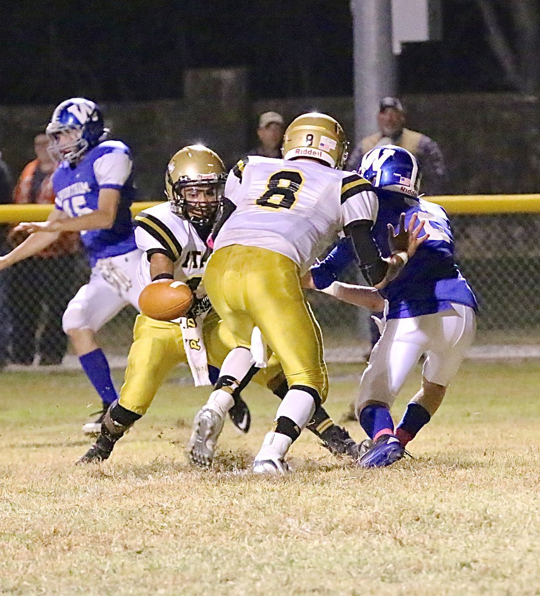 Image: Gladiator defensemen Fabian Cortez(11) and Joe Celis(8) break up a Bulldog pass attempt.