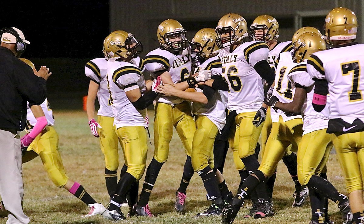 Image: Clayton Miller(6) gets congratulated by teammates after recovering an onside kick. It was no guts no glory time for the Gladiators who took a chance with a 7-point lead.