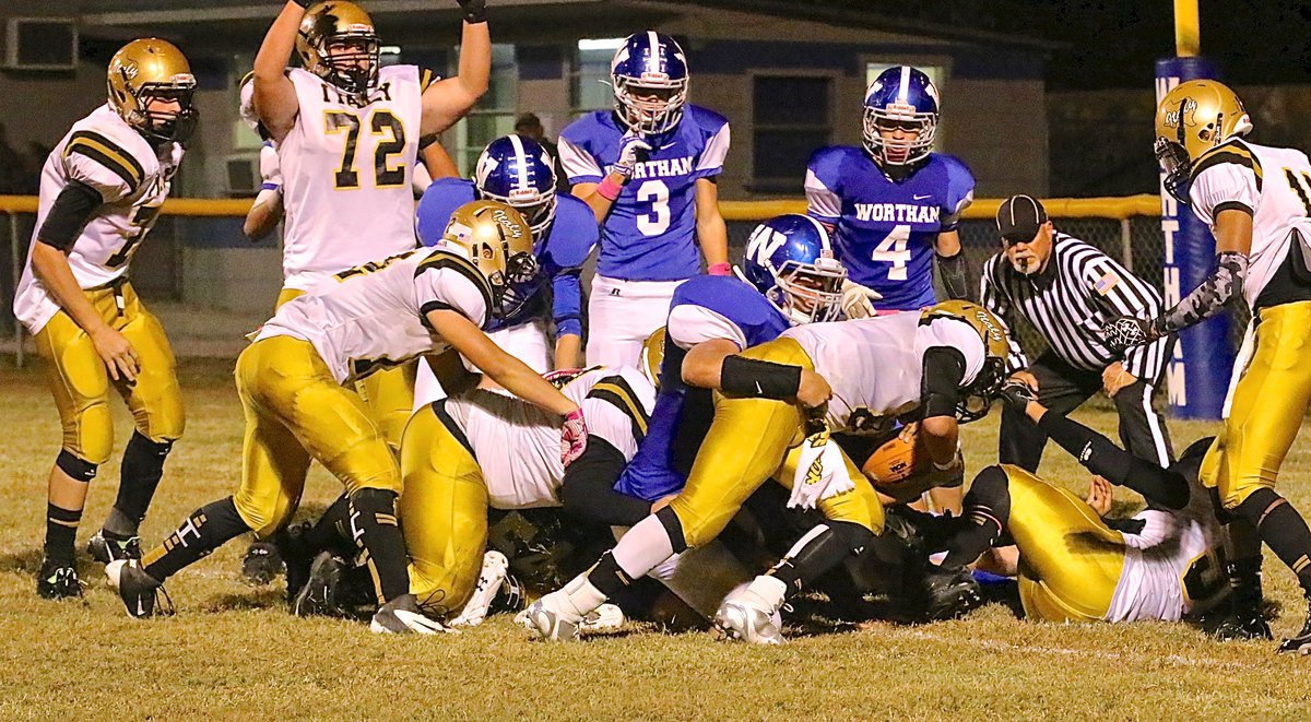 Image: Gladiator quarterback Joe Celis(8) lunges forward for the go ahead touchdown to give Italy the lead for good with 10:52 remaining in the contest. The scoring effort put Italy up 12-7.