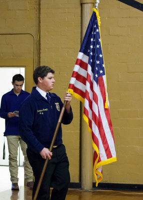 Image: FFA member Thomas Crowell presents the colors.