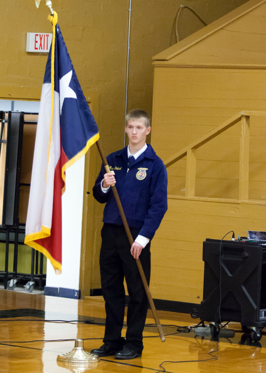 Image: FFA member Hunter Ballard presents the colors.