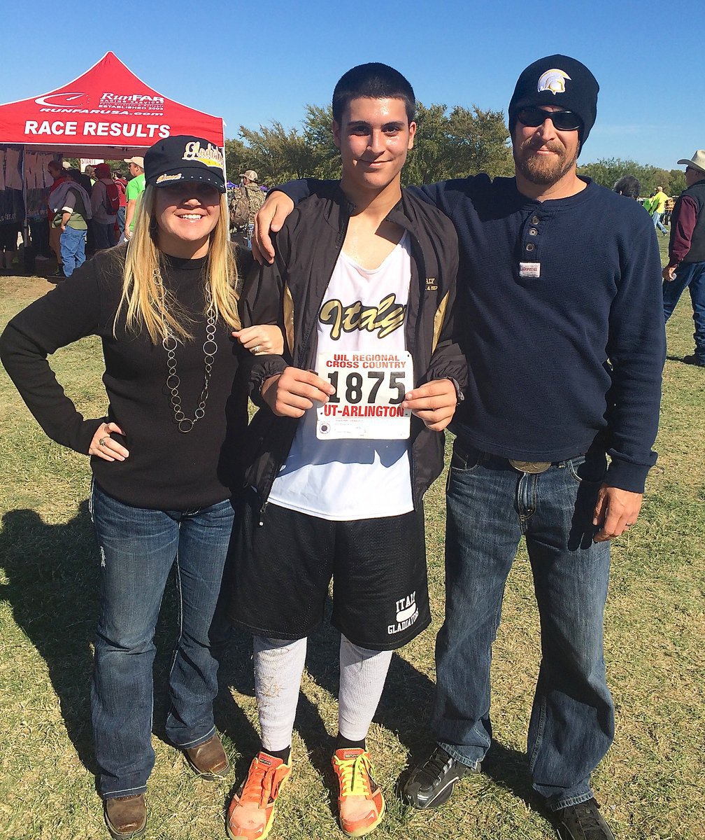 Image: Italy High School junior Gladiator Mason Womack (#1875) represented the Gladiators as the first male cross country runner to compete at UIL regionals in recent times. Here, Womack is pictured with his parents Michelle and Troy Kowalsky during the event which was hosted by the University of Texas at Arlington.