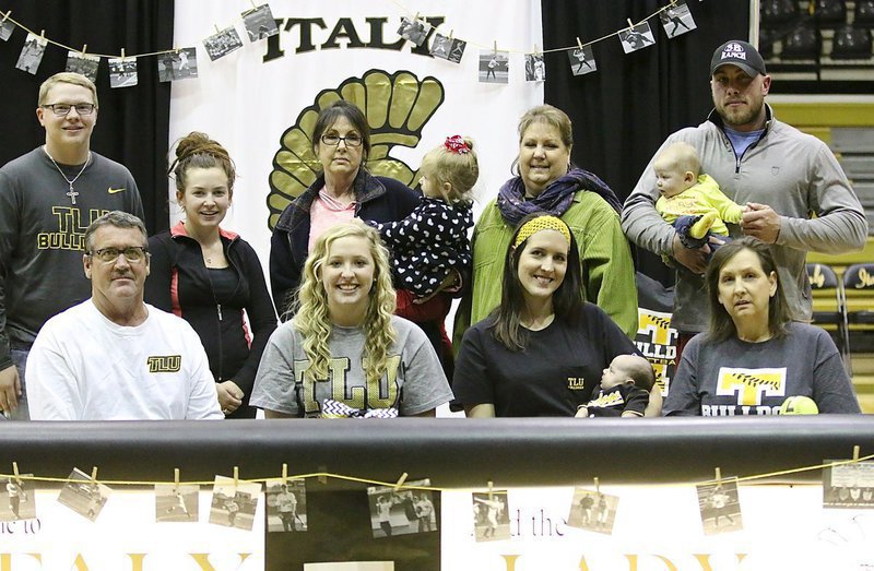 Image: The family is all in! — Jaclynn Lewis has the support of her family as she makes plans to play softball at the collegiate level. Back row (L-R):Josh Zapletal, Heather Styles, Patsy Howard, Rae Styles, Mina Watkins, Harlow Howard and Josh Howard. Front row (L-R): Russ Lewis, Jaclynn Lewis, Megann Lewis Harlow, Renn Harlow and Kelly Lewis.