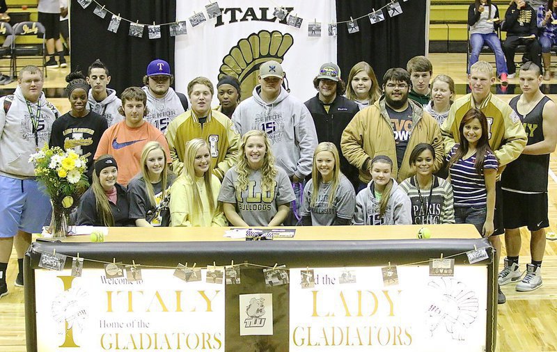 Image: Jaclynn Lewis is joined by her senior classmates after Lewis made her commitment to play softball for Texas Lutheran University official. Back row (L-R): Colin Newman, Jack Hernandez, Nathan Kerbow, K’Breona Davis, Kyle Fortenberry, Taylor Perry, Gary Kinkaid, Tia Russell and Cory Jeffords. Middle row (L-R): Kortnei Johnson, Sam Corley, John Escamilla, John Byers, Ty Fernandez and Cody Boyd. Front row (L-R): Reagan Cockerham, Kelsey Nelson, Madison Washington, Jaclynn Lewis, Bailey Eubank, Tara Wallis, Alex Minton and Anna Luna.