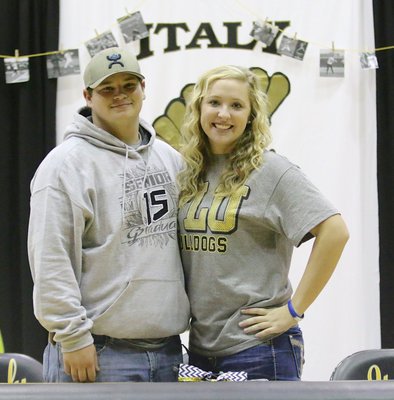Image: During her commitment ceremony, Italy Lady Gladiator softball pitcher Jaclynn Lewis is congratulated by Gladiator baseball’s John Byers who shares Jaclynn’s passion for playing on the diamond.