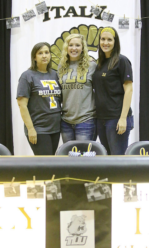Image: Italy High School senior Jaclynn Lewis poses with her mother Kelly Lewis and sister Megann Harlow Lewis after Jac committed to play softball for Texas Lutheran University.