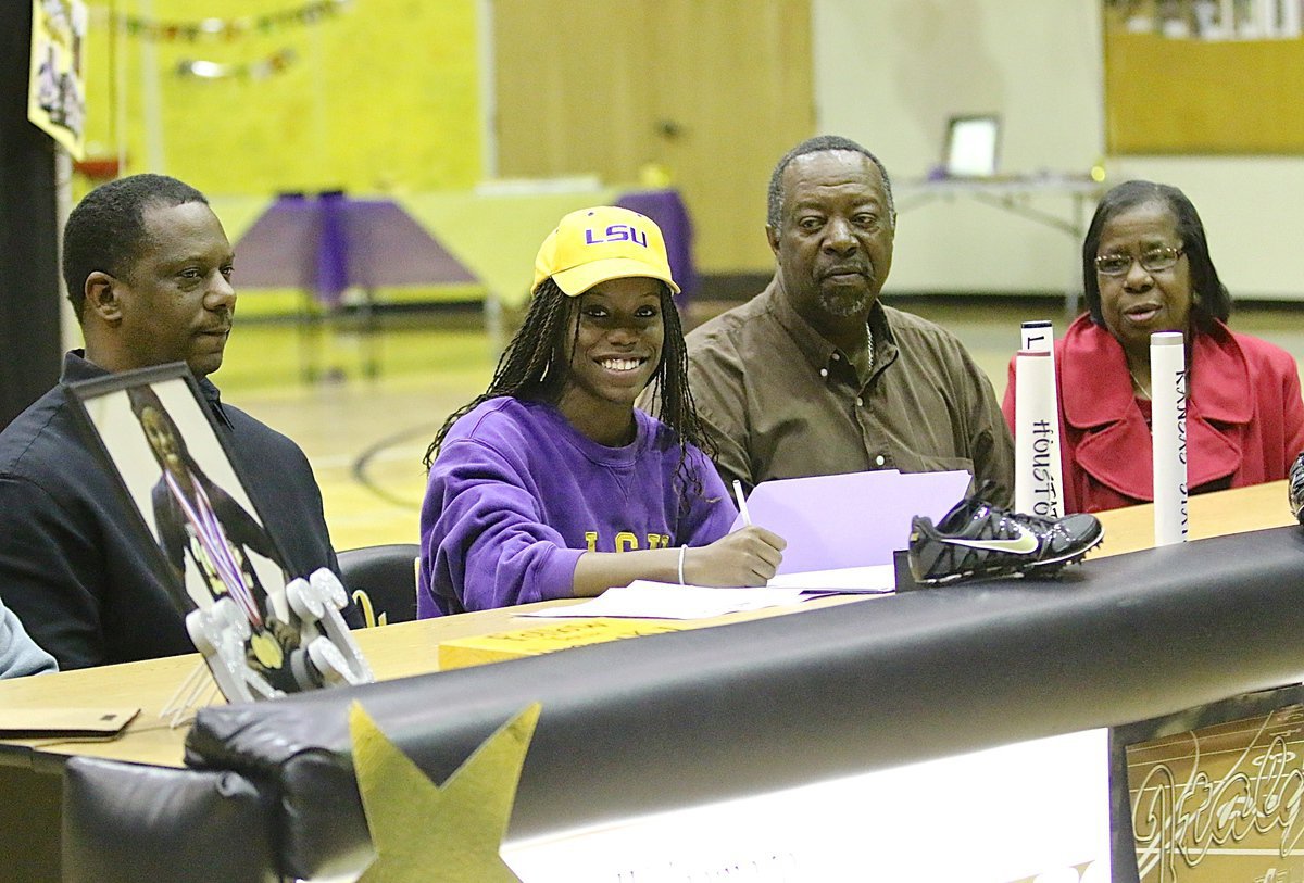 Image: Kortnei Johnson flashes a proud smile that stretches from Texas to California while signing her letter of intent to run track for the D1 LSU Tigers.