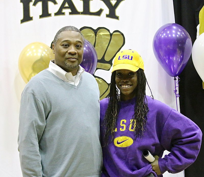 Image: Kortnei Johnson poses with her summer track coach Keith Herring after Johnson signed to compete for LSU in 2015.