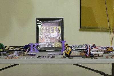 Image: A table display of pictures, shirts and medals lay out the journey that Italy High School’s Kortnei Johnson has been on for so long to make her dream of being a collegiate track athlete a reality.