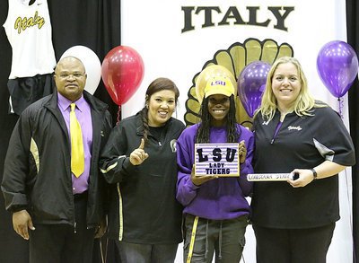 Image: Coaches Bobby Campbell, Tina Richards, and Melissa Fullmer helped get Kortnei Johnson to the finish line as the Italy High School senior looks ahead to being an LSU track team member in 2015.