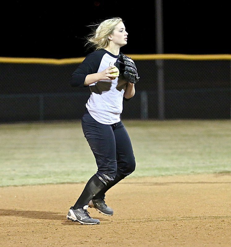 Image: Shortstop Madison Washington relays the ball in from the outfield.