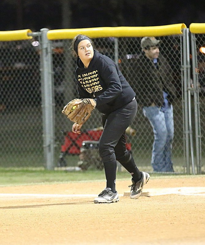 Image: Freshman Jenna Holden handles her first-baseman duties like a pro.