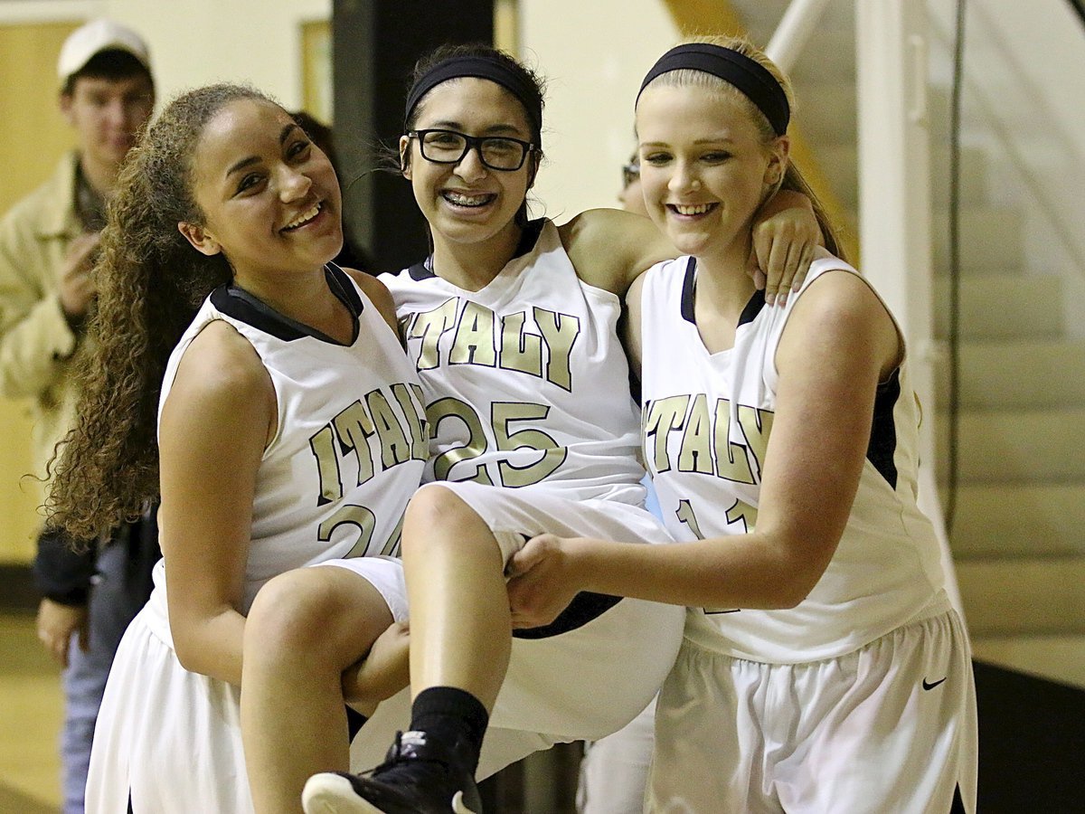 Image: Winning helps as does a little help from teammates Vanessa Cantu(24) and Annie Perry(11) who assist the injured Lizzy Garcia(25) to the locker room after an exciting finish against Axtell.