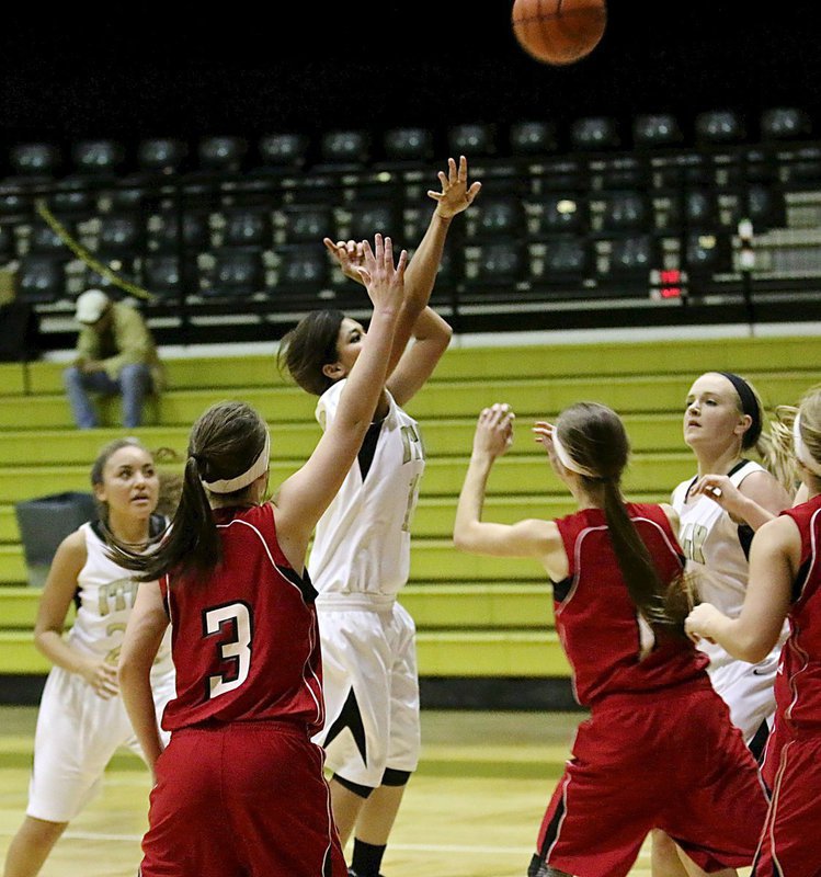 Image: Alex Minton(12) scores for the JV Lady Gladiators with a pull up in the lane. Minton led all scores with 15 points.