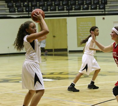 Image: Vanessa Cantu(24) and T’Keyah Pace(5) work the ball around looking for an opening in Axtell defenses.