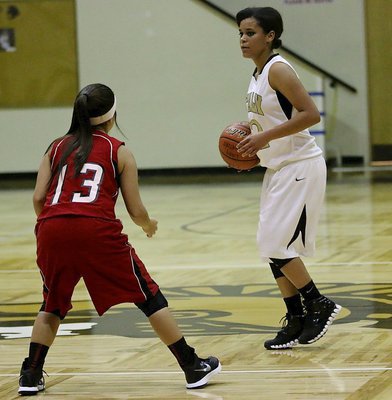 Image: JV Lady Gladiator point guard Alex Minton(12) sets up the offense against Axtell.