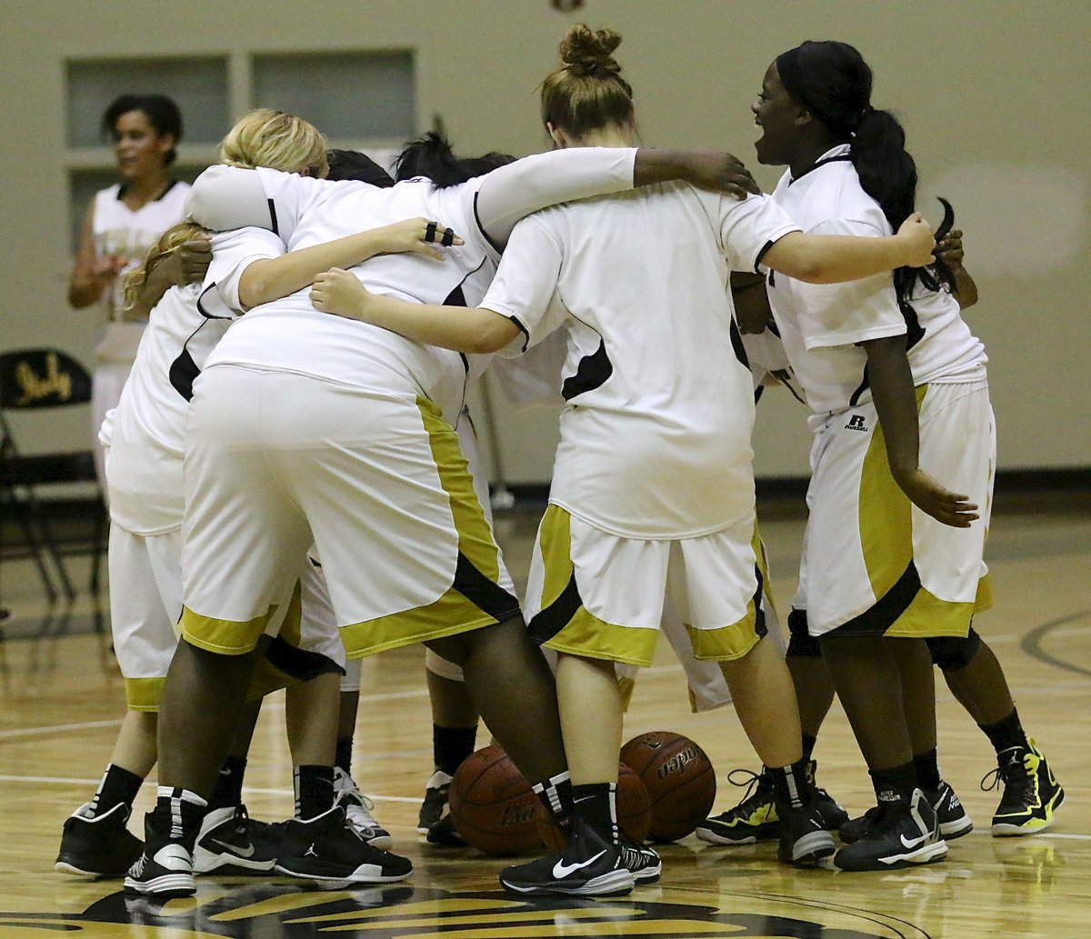 Image: The Italy Lady Gladiators get pumped up before taking on Axtell inside the Coliseum.