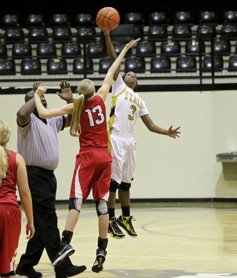 Image: Lady Gladiator Kortnei Johnson(3) sends an early message to Axtell.