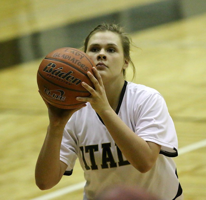 Image: Lady Gladiator Lillie Perry(24) dials in during warmups.