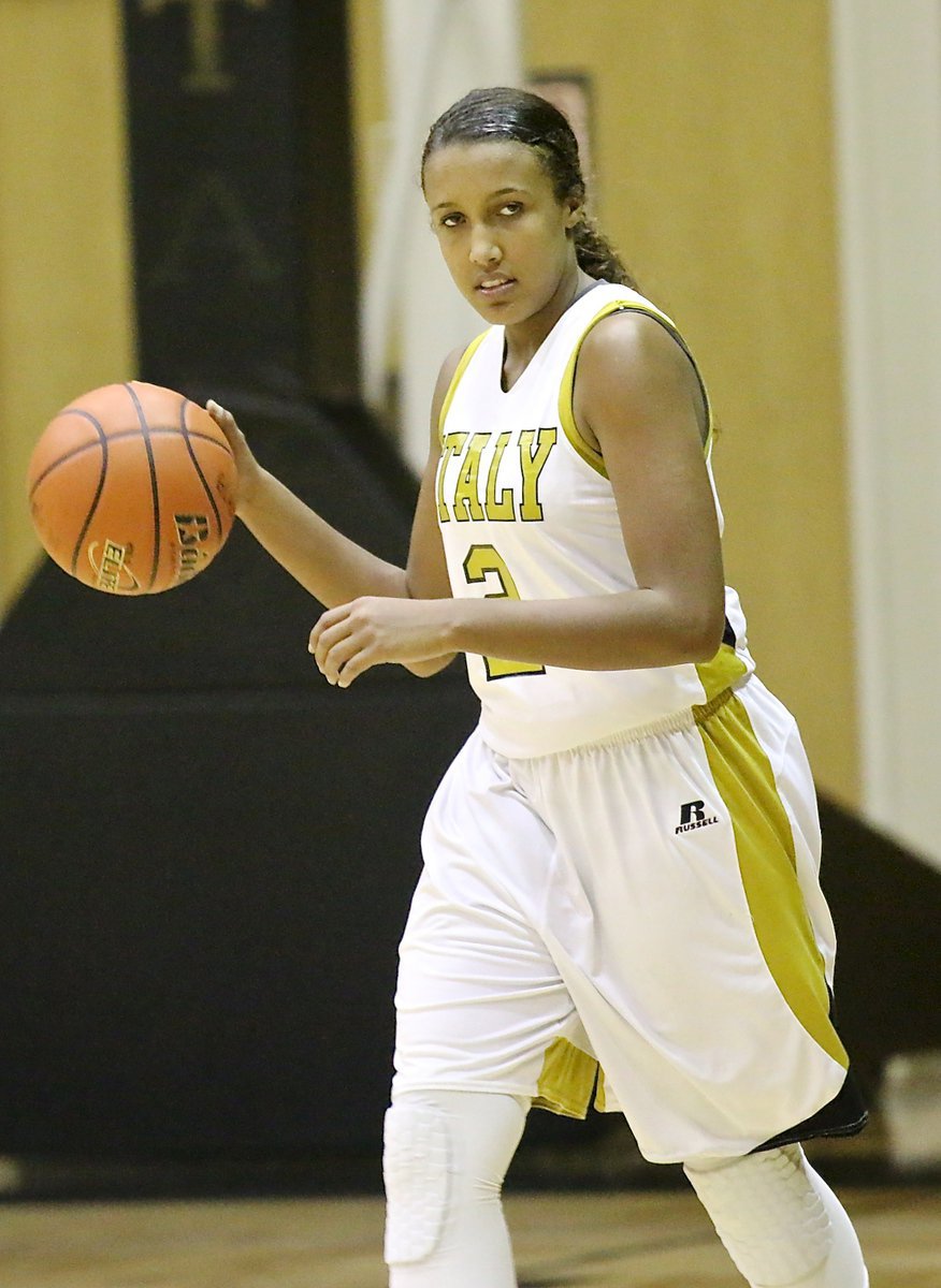 Image: Lady Gladiator Emmy Cunningham(2) brings the ball up the floor while seeing the entire floor.