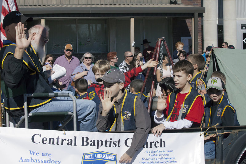 Image: The Royal Ambassadors from the Central Baptist Church in Italy enjoy a mobile campout during the parade with group leaders Clay Sparks and Murrie Wainscott relaxing in the moment.